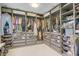Organized walk-in closet with plenty of storage and clothing racks at 117 Lotus Blossom Ct, Las Vegas, NV 89145