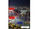 Night view of Topgolf with F1 Paddock and Racetrack (Harmon Ave) in the background, showing the city lights at 135 E Harmon Ave # 2116, Las Vegas, NV 89109