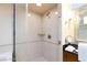 Bright bathroom featuring a shower with glass doors, adding a touch of modern elegance at 135 E Harmon Ave # 2116, Las Vegas, NV 89109