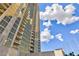 Exterior view showcases the high-rise architecture against a blue sky at 135 E Harmon Ave # 2116, Las Vegas, NV 89109