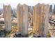 Exterior view showcases high-rise towers and surrounding cityscape at 135 E Harmon Ave # 2116, Las Vegas, NV 89109
