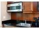 Close up of kitchenette area, showcasing sink, microwave and counter space at 135 E Harmon Ave # 2116, Las Vegas, NV 89109