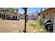 Spacious backyard, featuring both desert landscaping and traditional grassy areas at 1886 Ludington Ave, Las Vegas, NV 89156