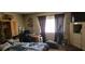 Comfortable bedroom with a desk area and large windows, perfect for relaxation at 1886 Ludington Ave, Las Vegas, NV 89156