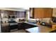 Functional kitchen with dark wood cabinets, a double sink, and modern appliances at 1886 Ludington Ave, Las Vegas, NV 89156
