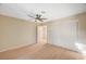 Bright bedroom with ceiling fan, closet, wood-look floors, and neutral paint at 1905 Plaza Del Padre, Las Vegas, NV 89102