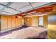 Spacious garage with built-in wooden cabinets and door leading inside at 1905 Plaza Del Padre, Las Vegas, NV 89102