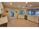 Modern kitchen with new stainless steel appliances, and view into open concept living area at 1905 Plaza Del Padre, Las Vegas, NV 89102