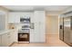 Modern kitchen with stainless steel appliances and white cabinets at 1905 Plaza Del Padre, Las Vegas, NV 89102