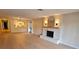 Spacious living room features a cozy fireplace and modern light wood flooring at 1905 Plaza Del Padre, Las Vegas, NV 89102