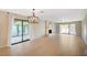 Spacious living room with light wood floors, fireplace, and sliding glass doors to the backyard at 1905 Plaza Del Padre, Las Vegas, NV 89102