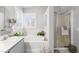 Bright bathroom featuring a soaking tub, separate shower, and double sink vanity at 2042 Maple Springs St, Henderson, NV 89002