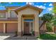 Inviting front porch featuring a decorative door, sidelight window and beautiful plantings at 2042 Maple Springs St, Henderson, NV 89002