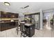 Spacious kitchen boasting granite countertops, dark cabinetry, and stainless steel appliances at 2042 Maple Springs St, Henderson, NV 89002