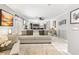 Bright, open living area showcasing seamless flow into the kitchen, adorned with modern décor at 2042 Maple Springs St, Henderson, NV 89002