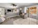 Comfortable living room featuring a fireplace and sliding glass doors to the pool at 2042 Maple Springs St, Henderson, NV 89002