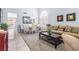 Open-concept living area featuring tile flooring, and stylish furniture at 2042 Maple Springs St, Henderson, NV 89002