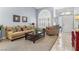 Sunlit living room with soaring ceilings, plush furnishings and a large window at 2042 Maple Springs St, Henderson, NV 89002