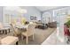 Open-concept living area featuring plantation shutters, and stylish furniture at 2042 Maple Springs St, Henderson, NV 89002