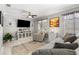 Inviting living room featuring modern decor, comfortable seating, and a ceiling fan at 2042 Maple Springs St, Henderson, NV 89002