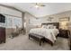 Relaxing main bedroom with natural light, a ceiling fan, and a neutral color palette at 2042 Maple Springs St, Henderson, NV 89002