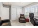 Office with lots of natural light, closet, and comfortable seating at 2042 Maple Springs St, Henderson, NV 89002