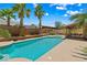 Swimming pool with mature landscaping, palm trees and private patio at 2042 Maple Springs St, Henderson, NV 89002