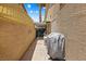 Narrow side yard with covered walkway and storage at 2042 Maple Springs St, Henderson, NV 89002