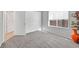 Carpeted bedroom showcasing a window with blinds and closet with sliding doors at 2110 Fort Sanders St, Henderson, NV 89052
