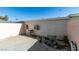 Backyard patio area with concrete flooring, access door, and satellite dish at 225 Pecos Way, Las Vegas, NV 89121