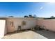 Backyard patio area with concrete flooring, access door, and exterior AC unit at 225 Pecos Way, Las Vegas, NV 89121
