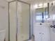 Bathroom featuring tiled floors, vanity sink, a mirror, and a standing shower with glass doors at 225 Pecos Way, Las Vegas, NV 89121