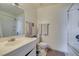 Bathroom featuring tile floors, vanity sink, toilet, and a bathtub/shower combo at 225 Pecos Way, Las Vegas, NV 89121