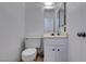 Well-lit half-bathroom includes modern fixtures and a marble counter at 225 Pecos Way, Las Vegas, NV 89121