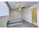 Bright bedroom featuring carpet, a ceiling fan, and a built-in closet for ample storage space at 225 Pecos Way, Las Vegas, NV 89121