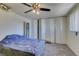 Bedroom featuring carpet floors, a ceiling fan, and built-in closet for ample storage space at 225 Pecos Way, Las Vegas, NV 89121