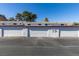 Photo shows a row of well-maintained white garages at the property at 225 Pecos Way, Las Vegas, NV 89121