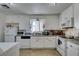 Bright kitchen features white cabinets, granite countertops, and stainless steel appliances at 225 Pecos Way, Las Vegas, NV 89121