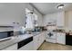 Bright kitchen features white cabinets, granite countertops, and stainless steel appliances at 225 Pecos Way, Las Vegas, NV 89121