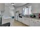 Bright kitchen features white cabinets, granite countertops, and stainless steel appliances at 225 Pecos Way, Las Vegas, NV 89121
