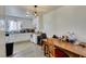 Eat-in kitchen featuring white cabinets and appliances, with a dining area at 225 Pecos Way, Las Vegas, NV 89121