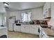 Bright kitchen features white cabinets, granite countertops, and stainless steel appliances at 225 Pecos Way, Las Vegas, NV 89121