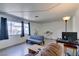 Bright living room featuring natural light from large windows and a comfortable seating area at 225 Pecos Way, Las Vegas, NV 89121