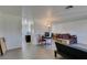 Bright living room with light wood-look flooring and neutral walls leads to entry hall at 225 Pecos Way, Las Vegas, NV 89121