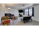 Living room with light wood-look floors, neutral walls, and large windows offering natural light at 225 Pecos Way, Las Vegas, NV 89121