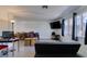 Living room featuring light wood-look floors, large windows, dining area, with neutral walls at 225 Pecos Way, Las Vegas, NV 89121