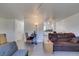 Open-concept living space with views to the kitchen area with light wood floors and neutral walls at 225 Pecos Way, Las Vegas, NV 89121