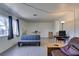 Inviting living room featuring windows, a futon, and a comfortable seating area at 225 Pecos Way, Las Vegas, NV 89121