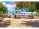 Large backyard with desert landscaping, privacy fence, and covered patio, offering space for relaxation at 2749 Del Mar Pl, Las Vegas, NV 89169