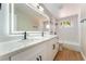 Modern bathroom has double sinks, quartz counters, and tiled shower at 2749 Del Mar Pl, Las Vegas, NV 89169